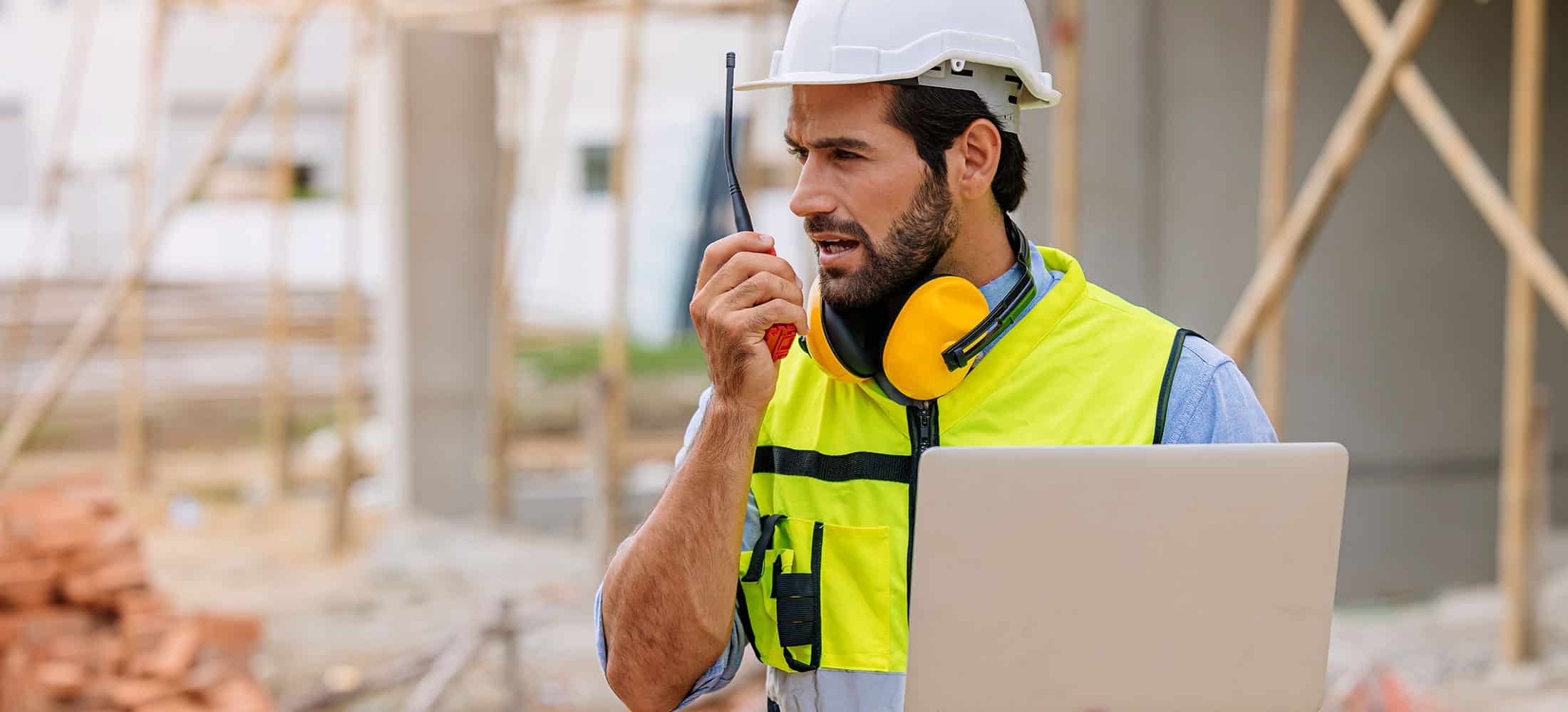 Builder working using radio command in home construction